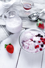 organic homemade ice cream in glass bowl on wooden background