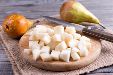 Cubes of pears on a cutting board on a table