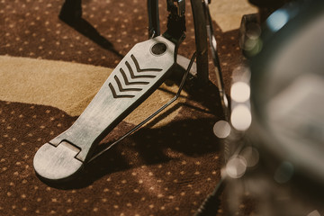 Close-up shot of drum pedal on carpet