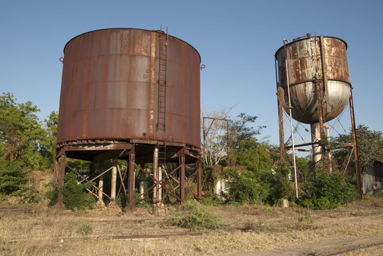Train station in ruins, rusty machinery, Zacapa railway museum, Guatemala,