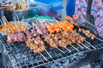 Chicken internal organs grill on charcoal stove at Sattahip market.Delicious local food.Street food of Thailand.