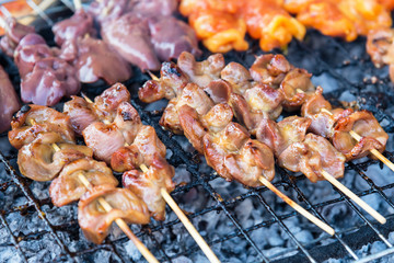 Chicken internal organs grill on charcoal stove at Sattahip market.Delicious local food.Street food of Thailand.
