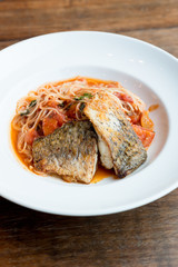 Grilled sea bass and spaghetti with tomato sauce