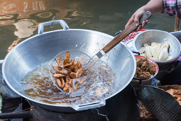 Banana fried in a large pan.Thailand.