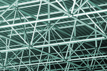 Wired metallic roof structure in a industrial building. Abstract background.