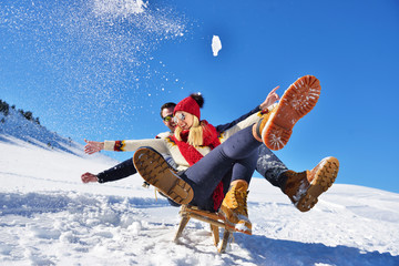 romantic winter scene, happy young couple having fun on fresh show on winter vacatio, mountain nature landscape