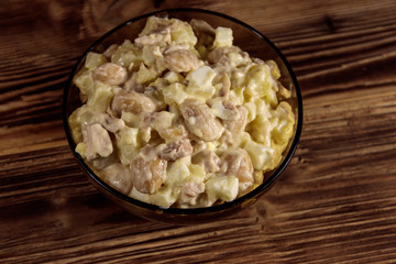 Salad with white kidney beans, potatoes, chicken meat, eggs and mayonnaise