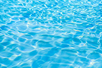 Fototapeta na wymiar Water abstract background, Swimming pool rippled.Under water tile of swimming pool floor.