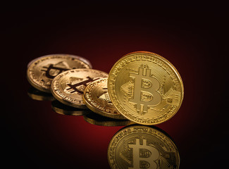 Bitcoin on dark red reflective background