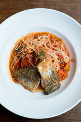 Grilled sea bass and spaghetti with tomato sauce