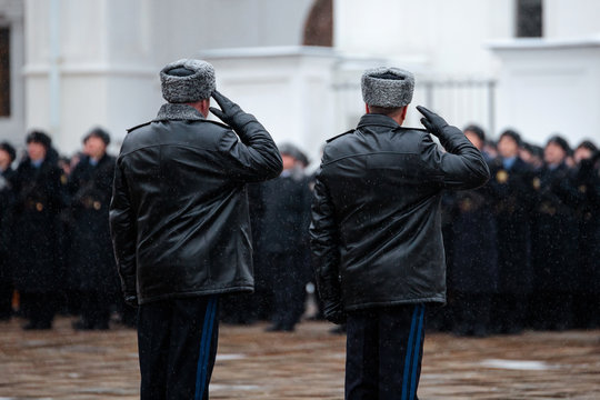 Two Russian army generasl. Salutation. Back view. Winter view.