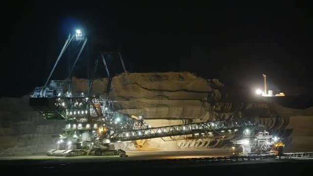 Opencast pit coal digger at night timelapse