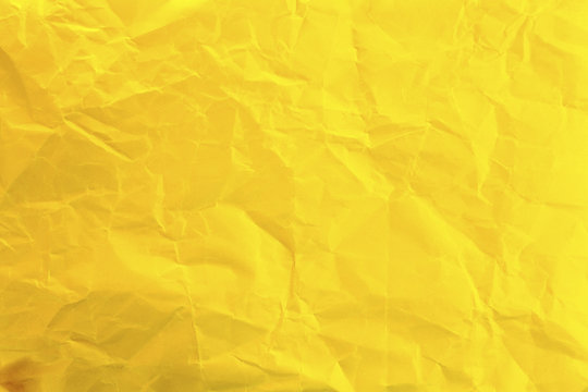 
Crumpled yellow paper as background
