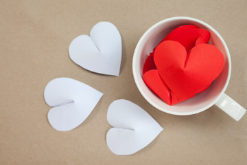 Heart-shaped paper in coffee cup Arrange as background. This is the symbol of love. For in February 14th, a day of love.