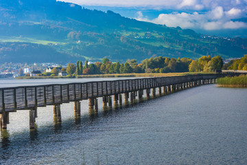 Fototapeta na wymiar Wooden bridge, Way of St James, Lake Zurich, Switzerland