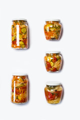 harvested vegetable salads homemade in glass jars isolated on white background