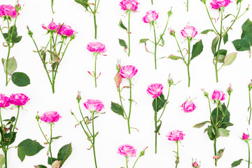 Floral pattern of pink roses, branches and leaves on white background. Flat lay, Top view. Roses flower texture