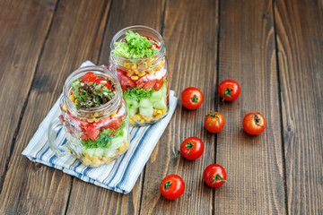 Vegetable is a useful delicious salad in glass jars. Healthy food, Diet, Detox, Clean Eating or Vegetarian concept