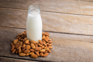 almond milk in bottle with Almonds