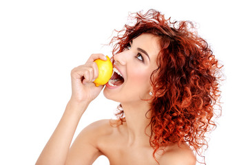 Obraz na płótnie Canvas woman eating lemon