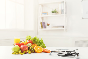 Nutritionist desk with fruit and stethoscope