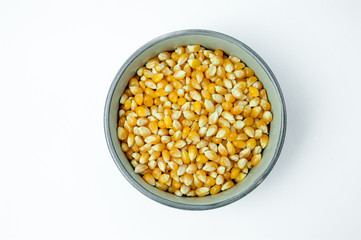 Dried corn in a bowl, isolated