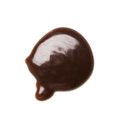 Chocolate caramel sauce on a plain white backround