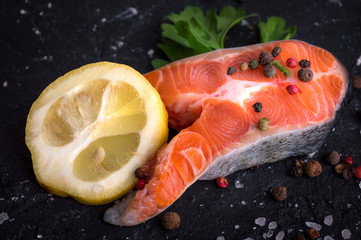 Salmon on a wooden table. Cooking fish