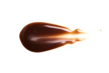 Chocolate caramel sauce stripe on a plain white backround