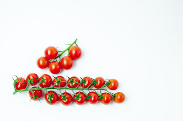 Cherry tomatoes on stem isolated, top view