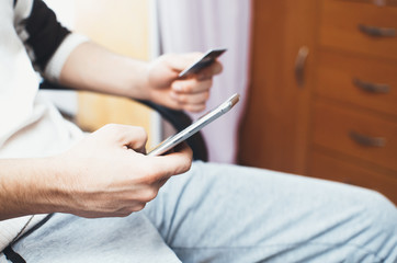 men hands, holding the phone and a visa card or other