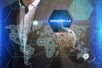 Business, Technology, Internet and network concept. Young businessman working on a virtual screen of the future and sees the inscription: Industry 4.0