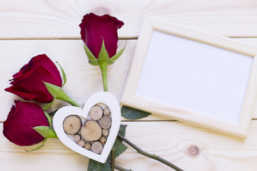 Red roses and photo frame