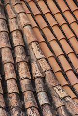 Old tile roof.Terracota background. Exterior pattern.
