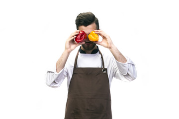 Fototapeta na wymiar chef isolated on white background, fooling around, covering his eyes with pepper