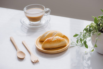 Morning breakfast with coffee and bread on table