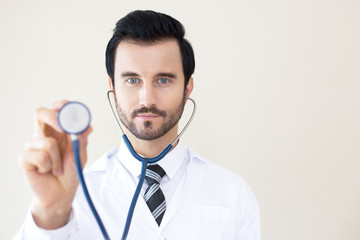 Doctor using stethoscope aith attractive smiling. People with medical concept.