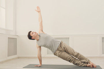 Fitness man plank training indoors