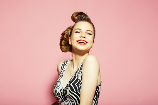 Woman with retro hair and fashionable makeup, pinup.