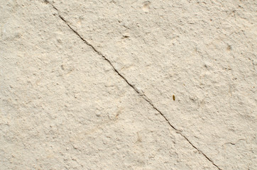 Natural color stone with a diagonal crack suitable for a background