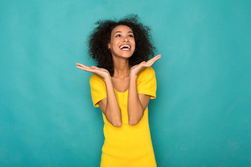 Young smiling african-american woman with arms out