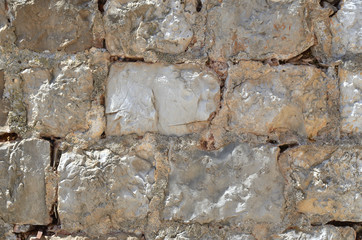 Rustic stone wall of a stall in coastal village