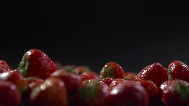 Close-up of the berries fall on the rest of the strawberry.