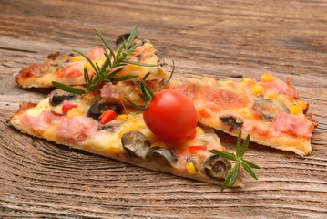 Delicious pizza served on wooden table