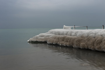 Large lumps of ice covering a pier on Lake Michigan