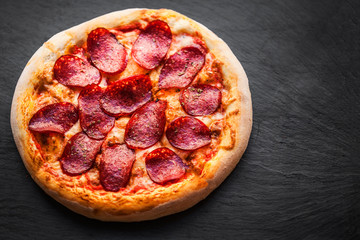 Pizza with tomatoes, cheese, pepper, herbs and olive  Ready to Eat. Fresh baked pepperoni pizza.
