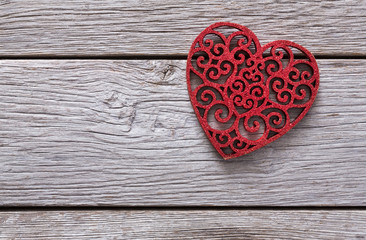 Valentine background with lace red heart shape on rustic wood