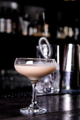 Baileys liqueur in glass on dark background. bar alcohol cocktail menu Milk liqueur.