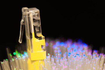 Yellow internet switch close up macro shot , blue , green  optical fibres.