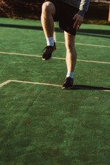 Young man doing workout in Austria on a basketball court